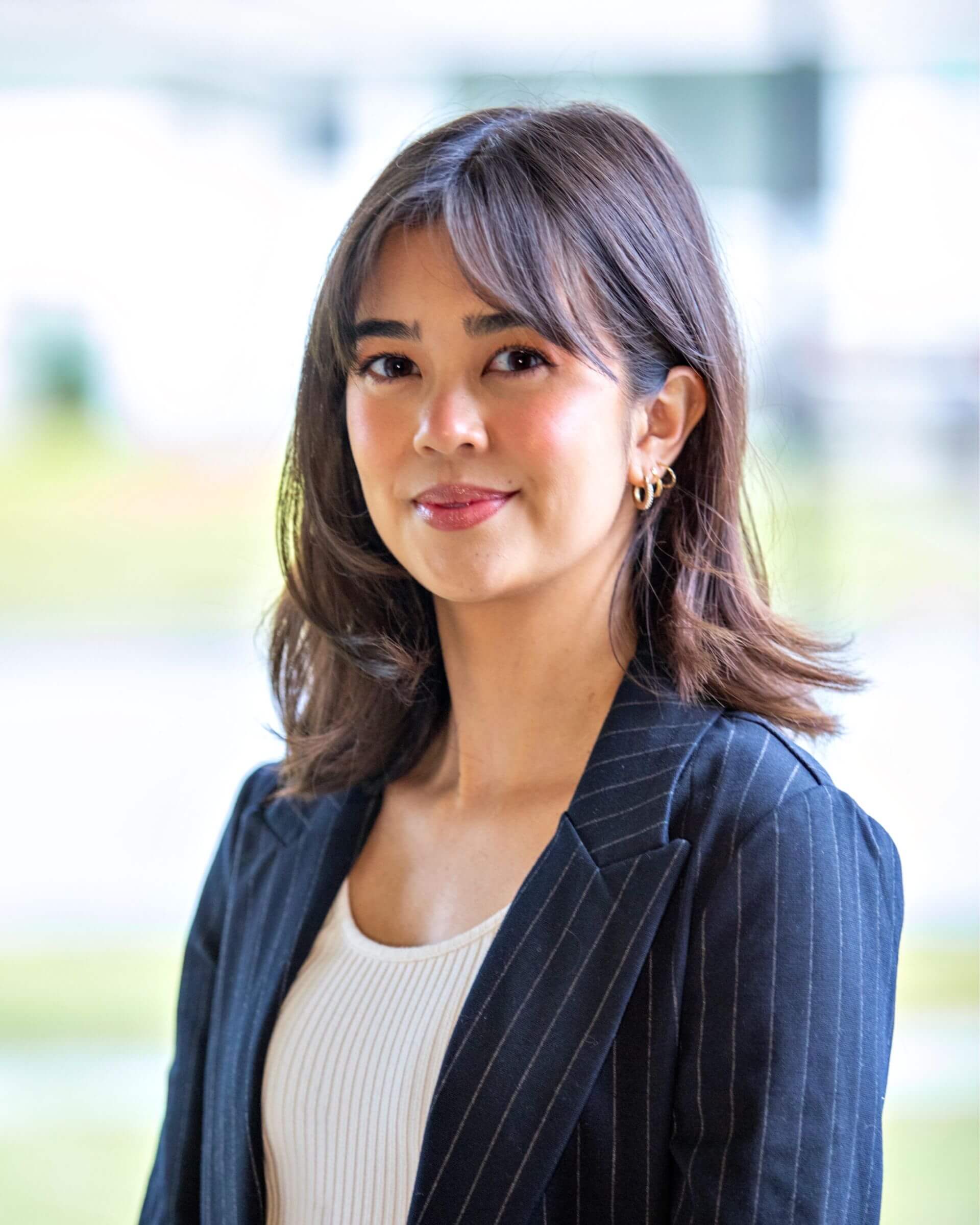 Levi-Lin Cummings in a business suit outdoors